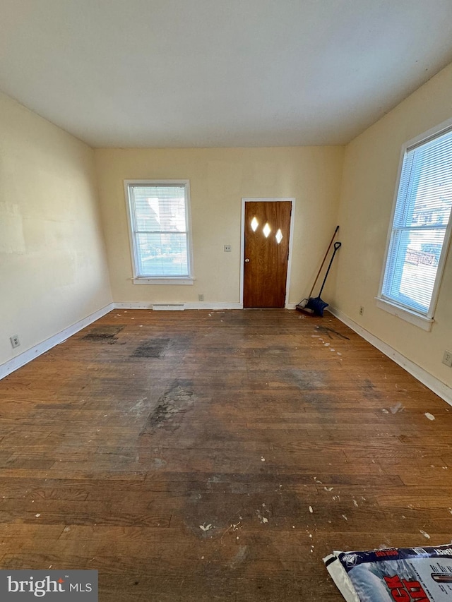 foyer entrance with dark wood-type flooring