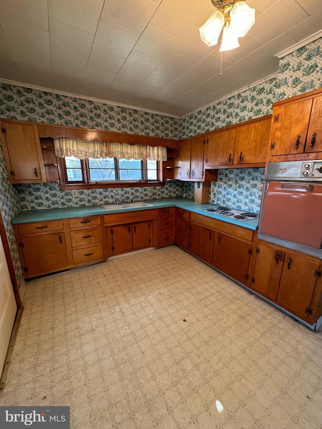 kitchen with white gas cooktop, ornamental molding, ceiling fan, and wall oven