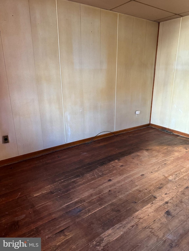 spare room with dark hardwood / wood-style floors