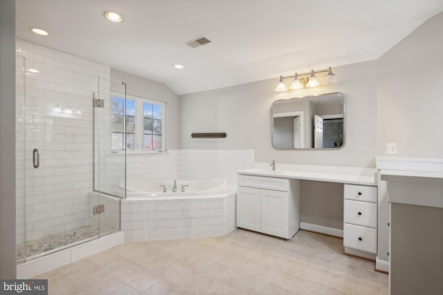 bathroom featuring shower with separate bathtub, vanity, and tile patterned floors