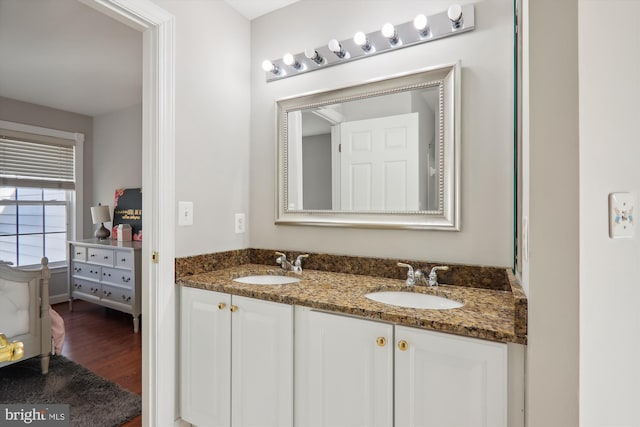 bathroom with vanity and hardwood / wood-style flooring