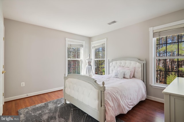 bedroom featuring dark wood-type flooring