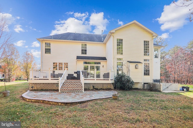 back of house with a yard and a deck