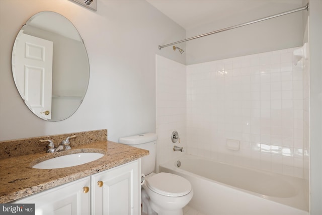 full bathroom with tiled shower / bath combo, toilet, and vanity