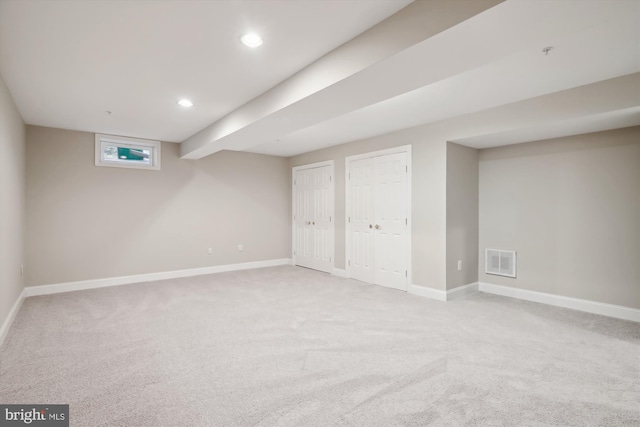 basement with light colored carpet