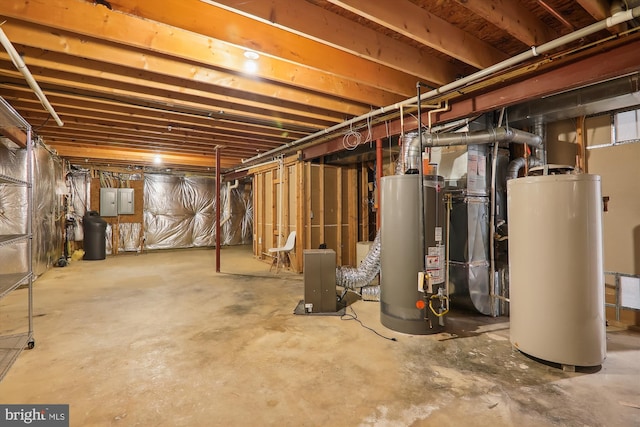 basement with electric panel, gas water heater, and heating unit