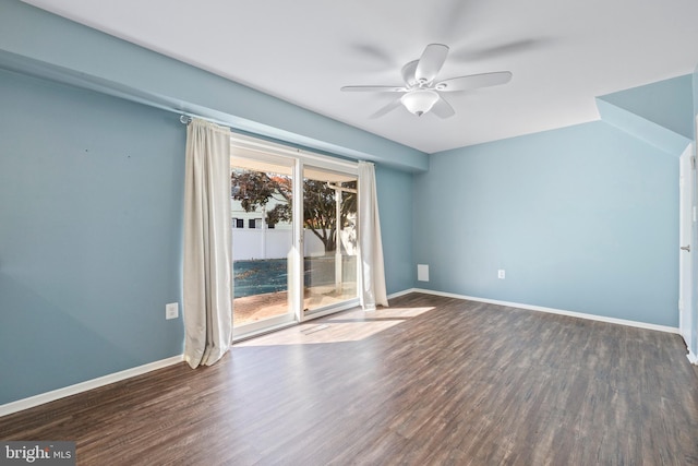 interior space featuring dark wood-type flooring and ceiling fan