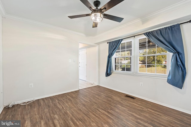 unfurnished room featuring ceiling fan, wood-type flooring, and ornamental molding