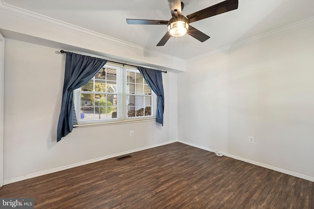 empty room featuring ceiling fan, dark hardwood / wood-style floors, and crown molding