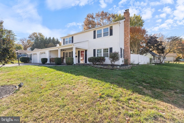 view of front of home featuring a garage and a front yard