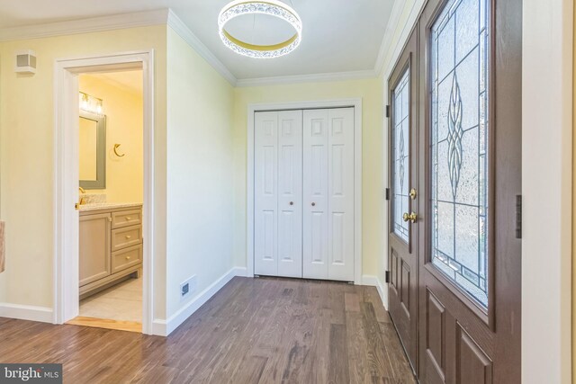 12700 Macduff Dr, Fort Washington, MD 20744 - foyer with wood finished floors, crown molding, and baseboards