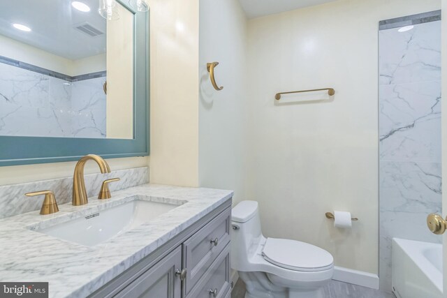 12700 Macduff Dr, Fort Washington, MD 20744 - bathroom with toilet, a bathtub, vanity, a shower, and baseboards