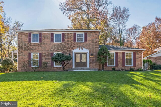 12700 Macduff Dr, Fort Washington, MD 20744 - view of front of house featuring french doors, a front yard, and brick siding
