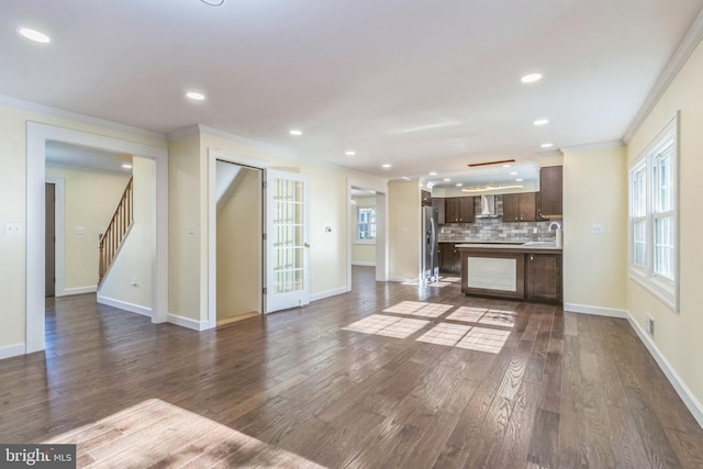 12700 Macduff Dr, Fort Washington, MD 20744 - unfurnished living room featuring ornamental molding, plenty of natural light, dark wood-type flooring, recessed lighting, and stairs