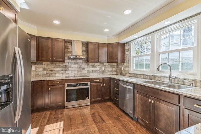 12700 Macduff Dr, Fort Washington, MD 20744 - kitchen with appliances with stainless steel finishes, wall chimney exhaust hood, a sink, crown molding, and dark wood-style flooring