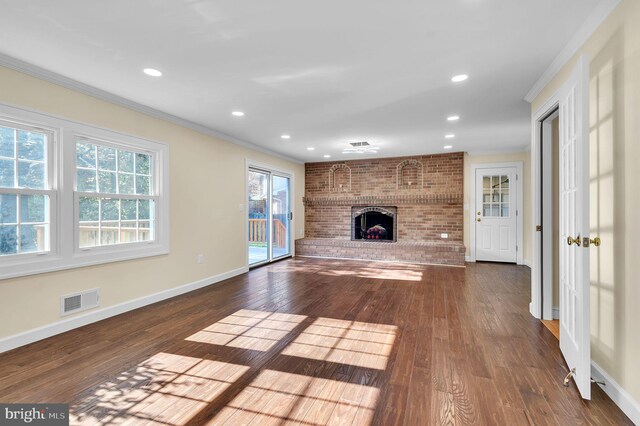 12700 Macduff Dr, Fort Washington, MD 20744 - unfurnished living room featuring ornamental molding, a brick fireplace, baseboards, dark wood-style floors, and recessed lighting