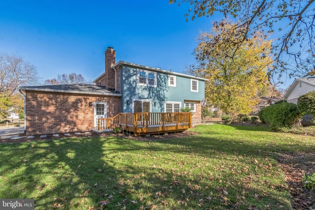 12700 Macduff Dr, Fort Washington, MD 20744 - rear view of house with a wooden deck, a chimney, a yard, and brick siding