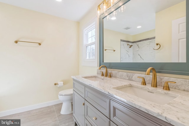 12700 Macduff Dr, Fort Washington, MD 20744 - full bath with baseboards, toilet, double vanity, and a shower