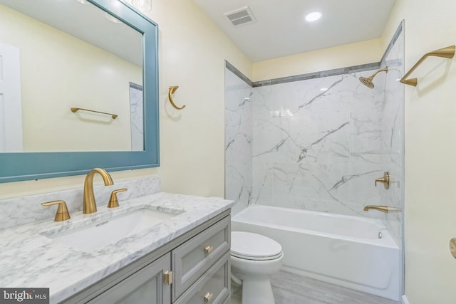 12700 Macduff Dr, Fort Washington, MD 20744 - bathroom featuring shower / tub combination, toilet, vanity, and wood finished floors