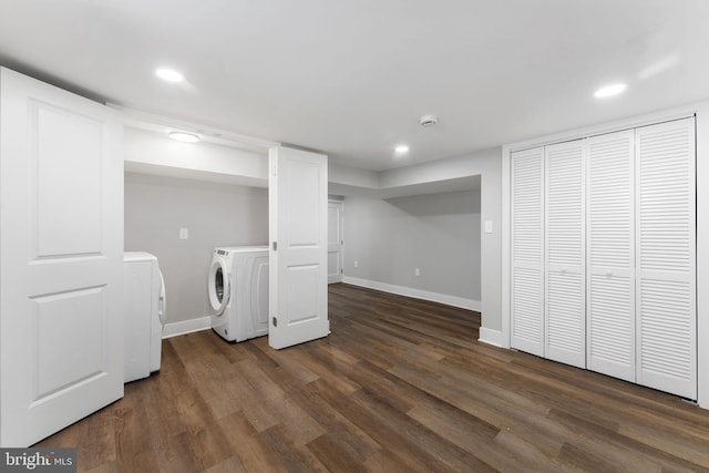 laundry room featuring dark hardwood / wood-style flooring and separate washer and dryer