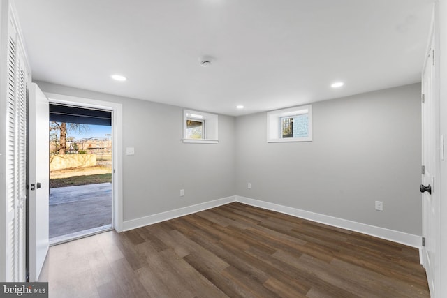 unfurnished room with dark hardwood / wood-style floors