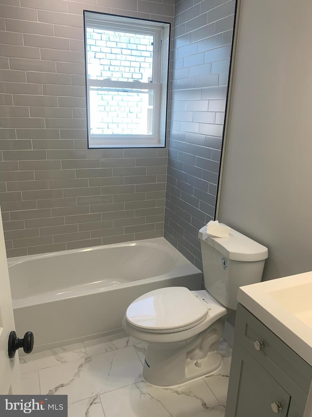 full bathroom with toilet, tiled shower / bath combo, and vanity