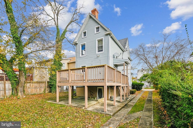 back of house featuring a deck