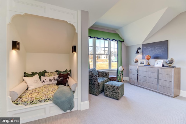 bedroom featuring lofted ceiling and light colored carpet