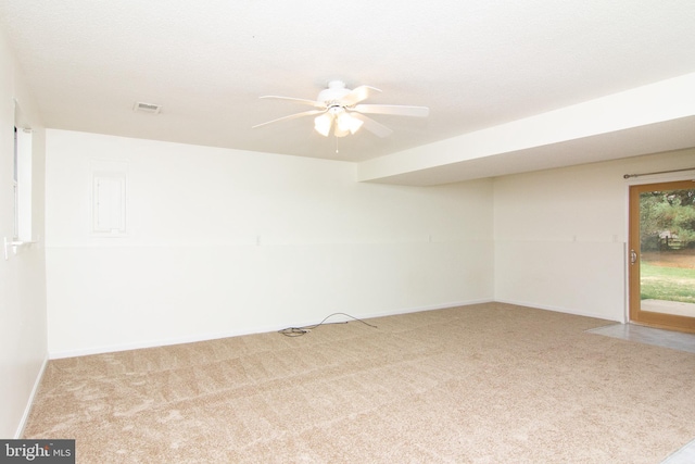 spare room with ceiling fan and carpet flooring