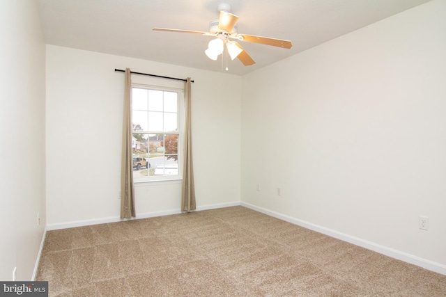 carpeted empty room with ceiling fan