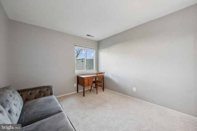 living area with light colored carpet