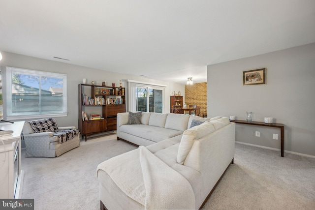 carpeted living room featuring a wealth of natural light