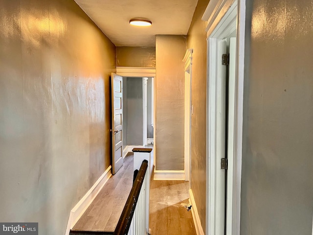 corridor featuring light hardwood / wood-style floors