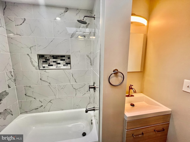 bathroom with vanity and tiled shower / bath combo