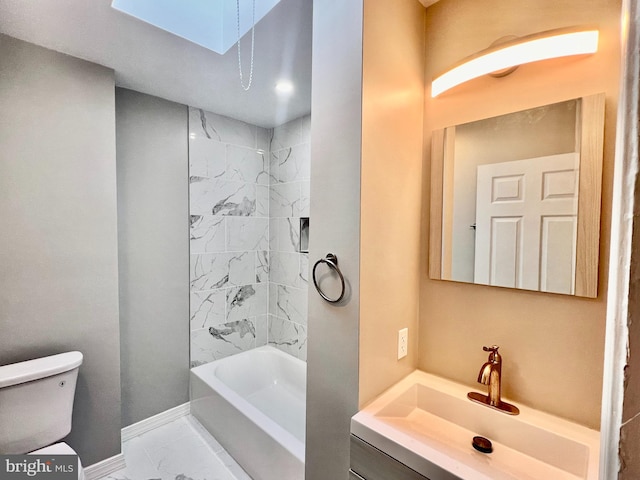 full bathroom featuring toilet, vanity, tiled shower / bath combo, and a skylight