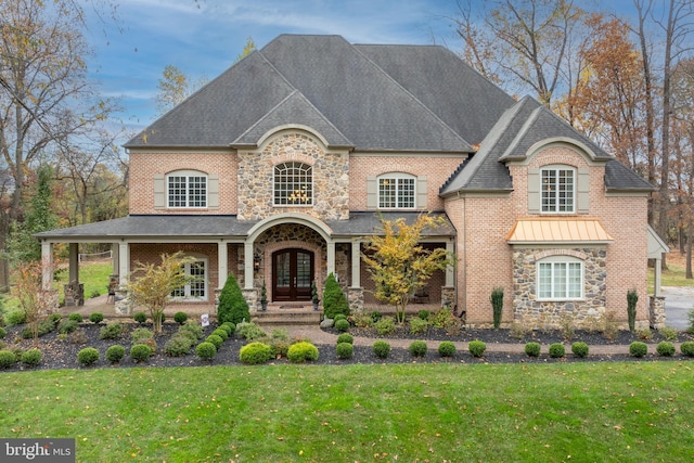 13105 Pendleton Ct, Reisterstown, MD 21136 - french country home featuring french doors, a front lawn, a shingled roof, and stone siding
