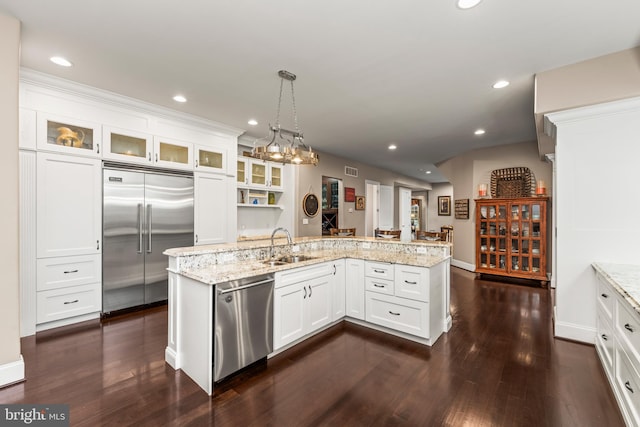 13105 Pendleton Ct, Reisterstown, MD 21136 - kitchen with appliances with stainless steel finishes, a sink, dark wood-style floors, white cabinets, and glass insert cabinets