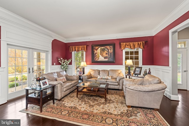 living room with crown molding, a healthy amount of sunlight, and dark hardwood / wood-style floors