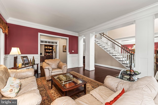 living room featuring dark hardwood / wood-style flooring and crown molding