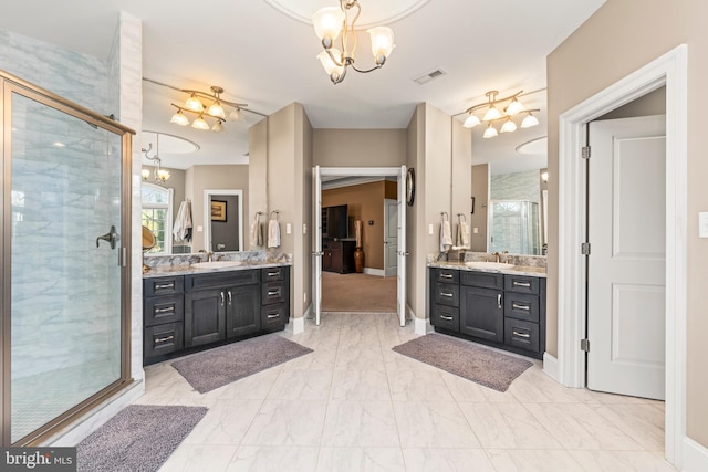 bathroom featuring walk in shower and vanity