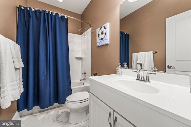 full bathroom featuring vanity, shower / bath combo with shower curtain, tile patterned floors, and toilet