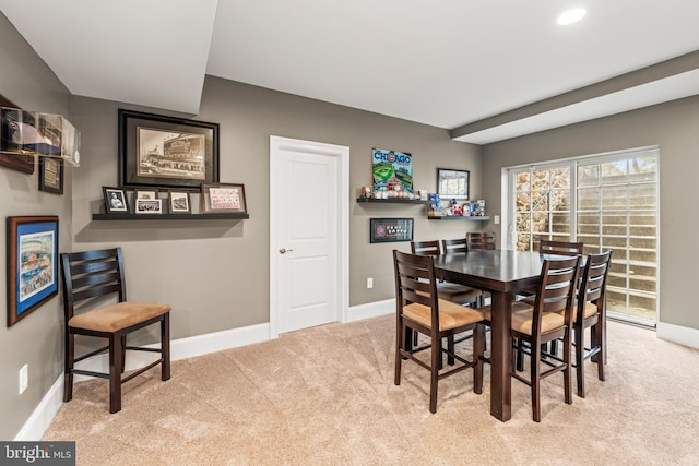 dining area with light carpet