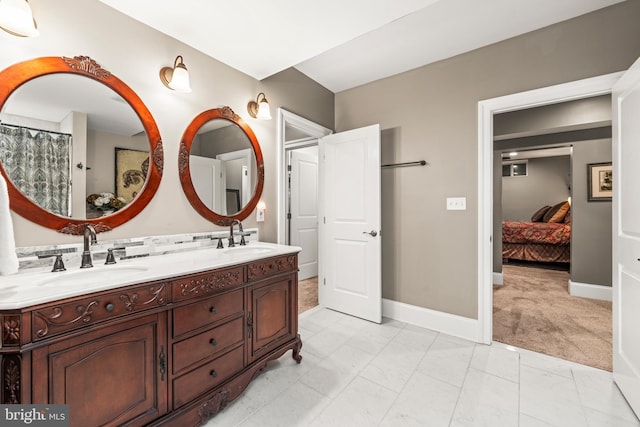 13105 Pendleton Ct, Reisterstown, MD 21136 - bathroom with marble finish floors, baseboards, double vanity, and ensuite bath