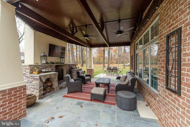 sunroom featuring wood ceiling, ceiling fan, and beam ceiling