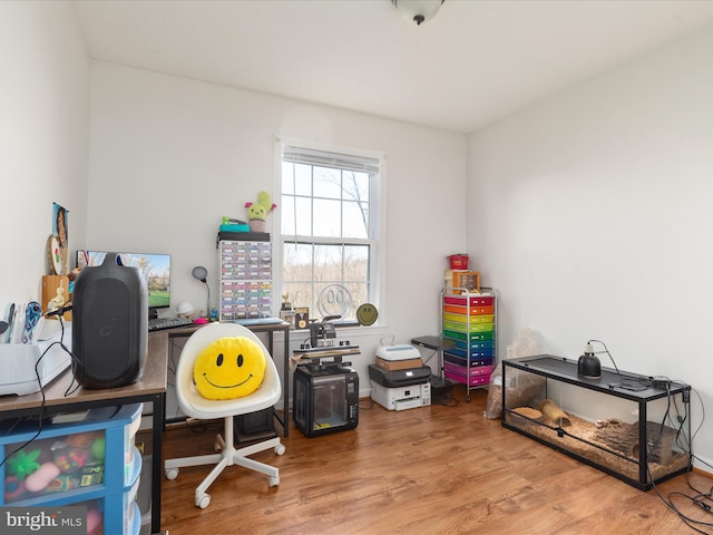 office space with wood-type flooring