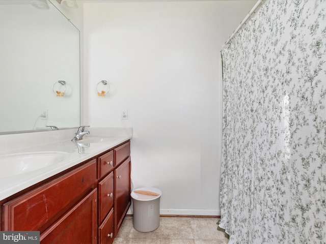 bathroom featuring tile patterned flooring, vanity, and a shower with shower curtain