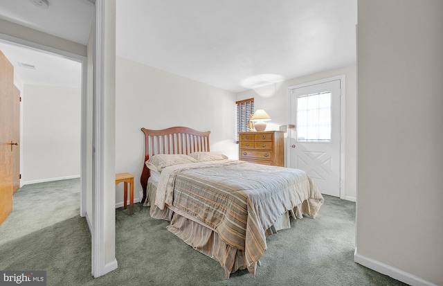 bedroom featuring dark carpet