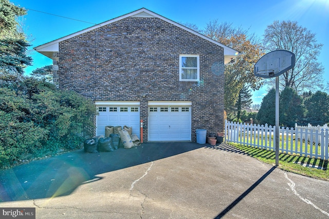 view of side of property with a garage