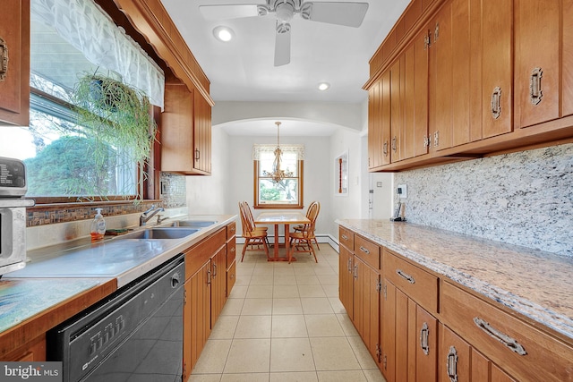 kitchen with dishwasher, backsplash, hanging light fixtures, and a healthy amount of sunlight