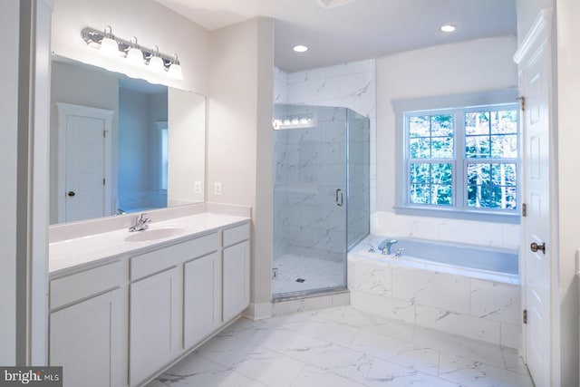 bathroom featuring independent shower and bath and vanity